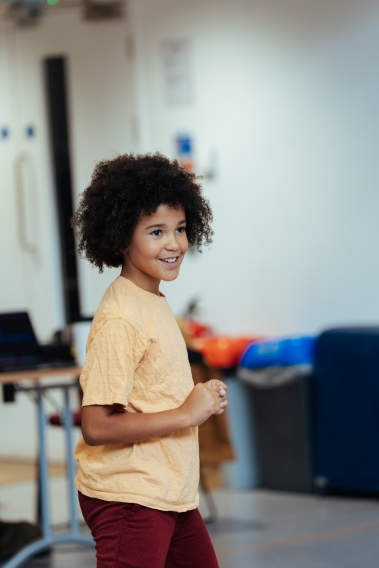 Photograph of Atlas smiling in rehearsals