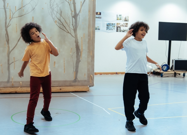 photograph of two young boys dancing 