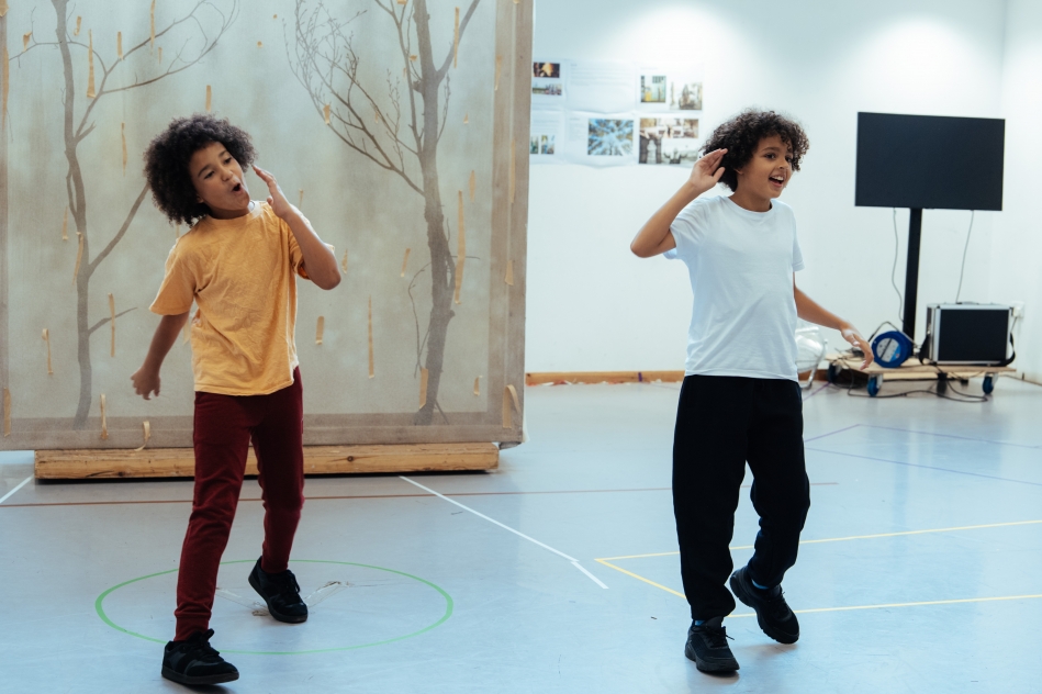 photograph of two young boys dancing