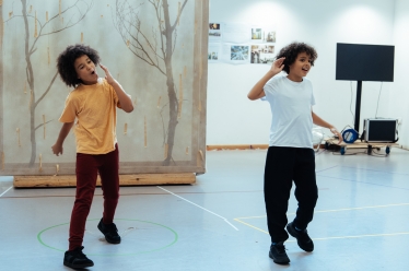 photograph of two young boys dancing 