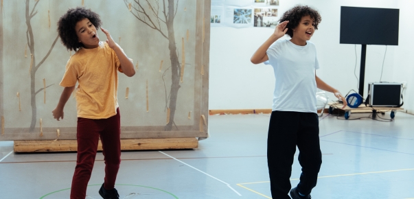 photograph of two young boys dancing 